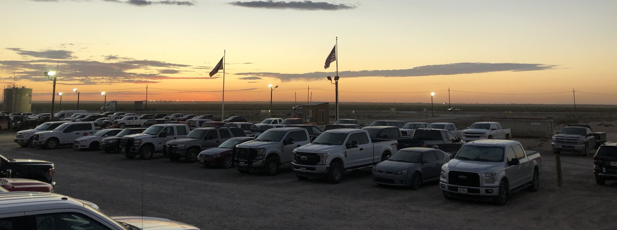 Picture of cars and a beautiful sunset.